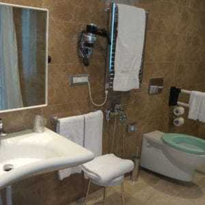 Wider View Of Accessible Bathroom At Doubletree Hilton in Olbia